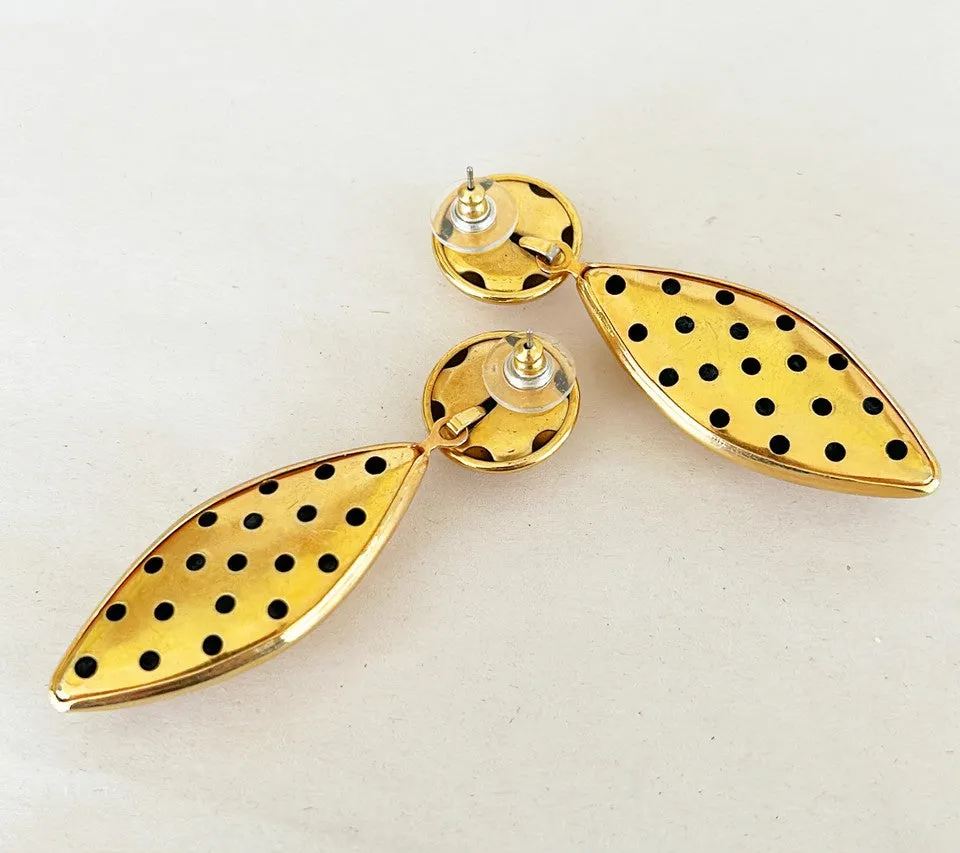 Bold large statement 80s pierced earrings.