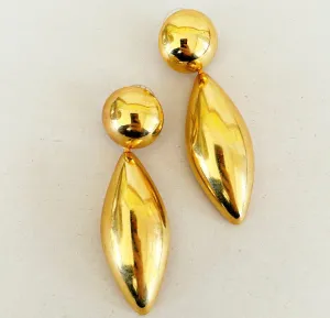 Bold large statement 80s pierced earrings.